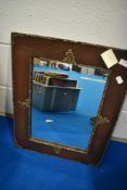 A vintage oak ply mirror with foliate applique decoration