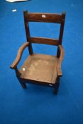 A Victorian oak child's commode chair