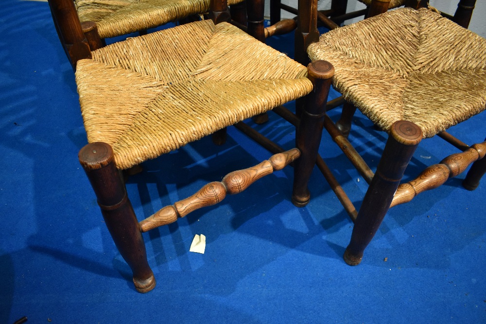 A set of six 19th century rush seated ladder back chairs