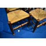 A set of six 19th century rush seated ladder back chairs