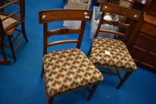 A pair of 19th Century railback dining chairs with later woolwork seats