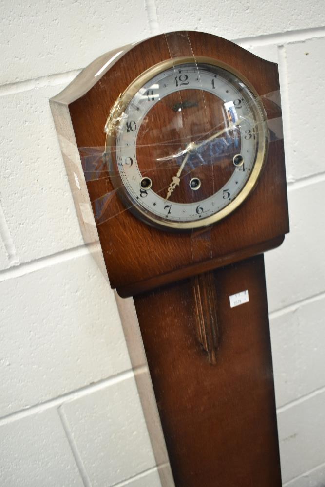 An early to mid 20th Century oak cased grandmother clock