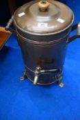 A vintage copper tea urn