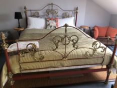 A red metal and brass bed frame (base mattress and bedding not included), width approx 180cm