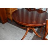 A reproduction Regency pedestal dining table and six (4 plus 2) chairs