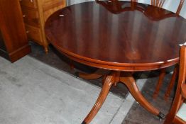 A reproduction Regency pedestal dining table and six (4 plus 2) chairs