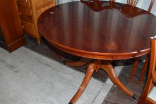 A reproduction Regency pedestal dining table and six (4 plus 2) chairs