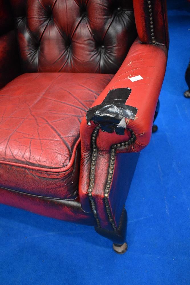 A pair of red leather button back wing armchairs - Image 2 of 2