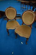 A pair of French style oak salon chairs having dralon upholstery