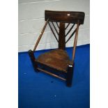 A period elm turners chair having turned spindle back, arms and stretchers, with plank seat,