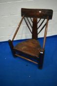 A period elm turners chair having turned spindle back, arms and stretchers, with plank seat,