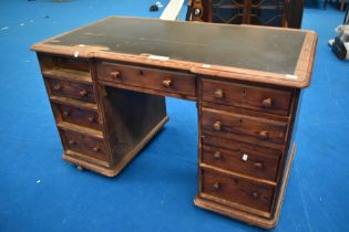 A Victorian pitch pine pedestal style desk, approx. 130 x 72cm