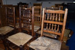 A set of six (five plus one) spindle back kitchen chairs, having rush seats, some damage to one
