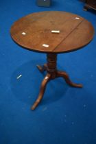 A 19th Century oak pedestal table having turned column , diameter approx 60cm