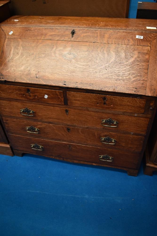 An 18th Century and later golden oak bureau , dimensions approx W99 H97 D50cm