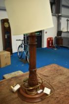 An early 20th Century table lamp having carved column, height approx 59cm, diameter of base 20cm