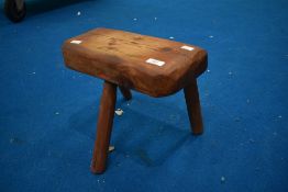 A rustic three legged milking copy (stool), approx dimensions W34 H28 D14cm