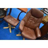 A brown leather swivel armchair and footstool on beech frame