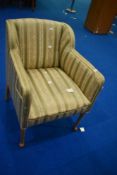 A low armchair having horse hair stuffing and classic upholstery, on bleached or stripped frame,