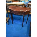 A reproduction mahogany hall table