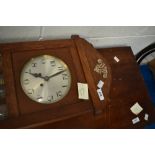 A mid 20th Century oak wall clock and two aneroid barometers