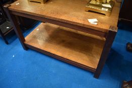 A vintage golden oak coffee table with undertier, width approx 81, depth 41cm