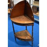 A 19th Century mahogany corner washstand or shelf, with faux drawers to both friezes