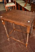 An early 20th Century oak twist leg occasional table and a similar period dining chair