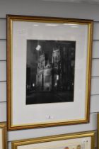 A monochrome photographic print, a view of York Minster at night, mounted framed and glazed 32cm x