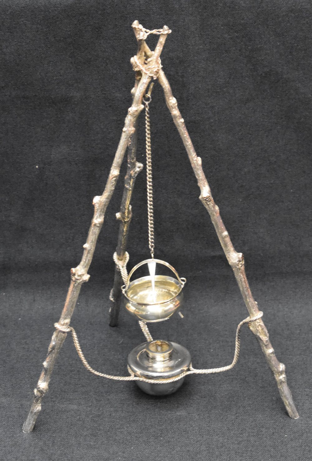 An unusual Victorian silver-plated spirit burner, formed as a rustic cooking tripod with the three