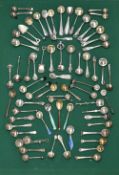 A collection of 19th and 20th century silver and white metal condiment and salt spoons of various