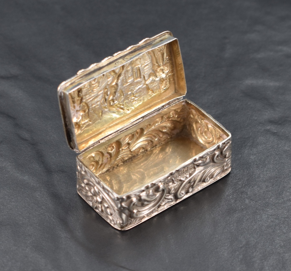A late Victorian silver box, of hinged rectangular form, the cover embossed with musician and dancer - Image 2 of 3