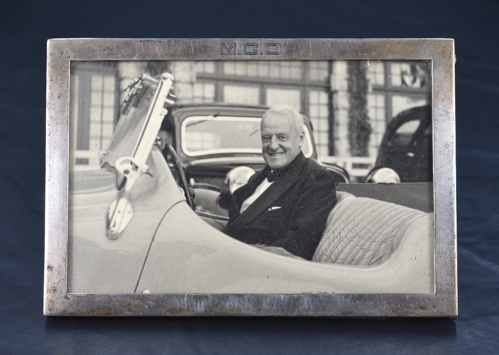 A 1930's George VI Silver photograph frame, of plain rectangular form with engraved initials M.C.