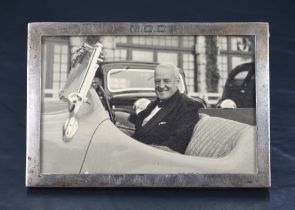 A 1930's George VI Silver photograph frame, of plain rectangular form with engraved initials M.C.