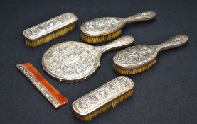 A late 19th/early 20th century eastern white metal mounted six piece dressing table or vanity set,
