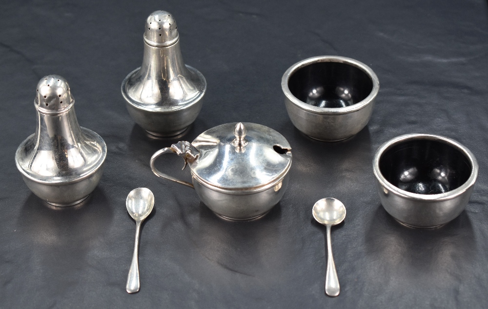 A cased 1930's silver and bakelite condiment set, comprising two salts, mustard (with bakelite
