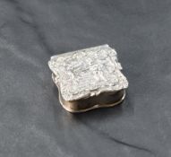 A Queen Elizabeth II silver pill box, of small proportions and of hinged and shaped square form, the