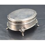 A George V silver ring box, of hinged oval form, the cover with engraved inscription dated 1916