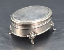 A George V silver ring box, of hinged oval form, the cover with engraved inscription dated 1916