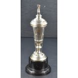 A George V silver golfing trophy, of slender tapering urn form, the moulded circular cover with