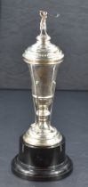 A George V silver golfing trophy, of slender tapering urn form, the moulded circular cover with