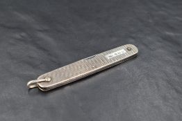 A George VI silver mounted steel bladed pocket knife, with engine turned surface detail, engraved