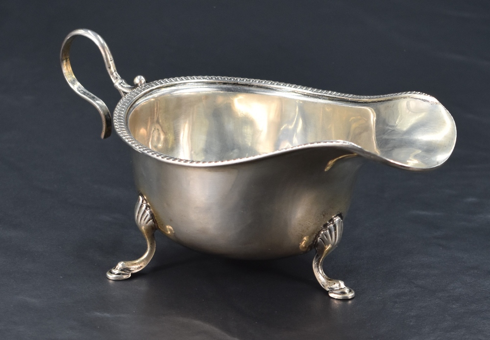 A George V silver sauce or gravy boat, of traditional design with egg-and-dart moulded rim, generous