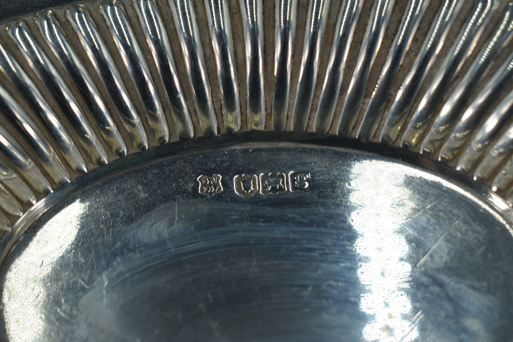 An Edwardian silver dish, of oval form with scroll-pierced and fluted booge, marks for London - Image 2 of 4