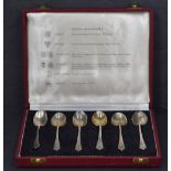 A cased set of six Queen Elizabeth silver teaspoons, having tapering and pointed terminals, each