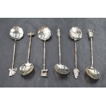 A cased set of six sterling grade white metal coffee spoons, of oriental inspired designs with