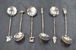 A cased set of six sterling grade white metal coffee spoons, of oriental inspired designs with