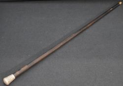 A 19th century white metal mounted rosewood walking cane, the tapering rosewood shaft surmounted