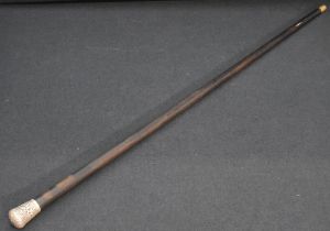 A 19th century white metal mounted rosewood walking cane, the tapering rosewood shaft surmounted