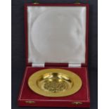 A Queen Elizabeth II silver gilt 'The Tudor Rose Dish' a replica of the St Georges Chapel, Windsor